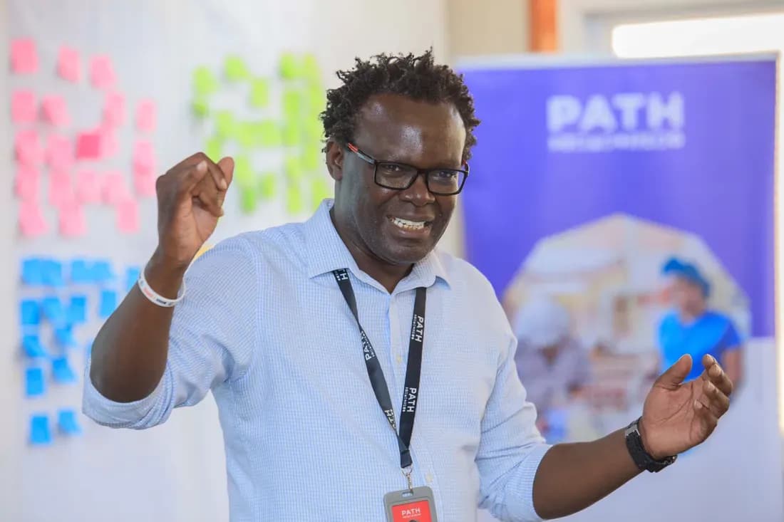A PATH partner speaking animatedly at a Surround Sound Kenya event