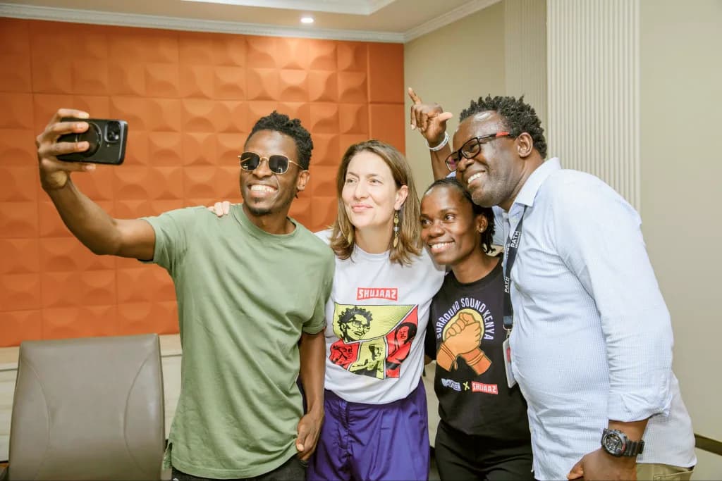 Four young people taking a selfie together at a Surround Sound Kenya session
