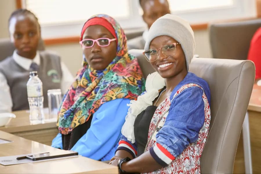 Two young women smiling during a session